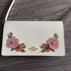 COACH floral white crossbody bag,burnt orange interior,gold hardware,never used
